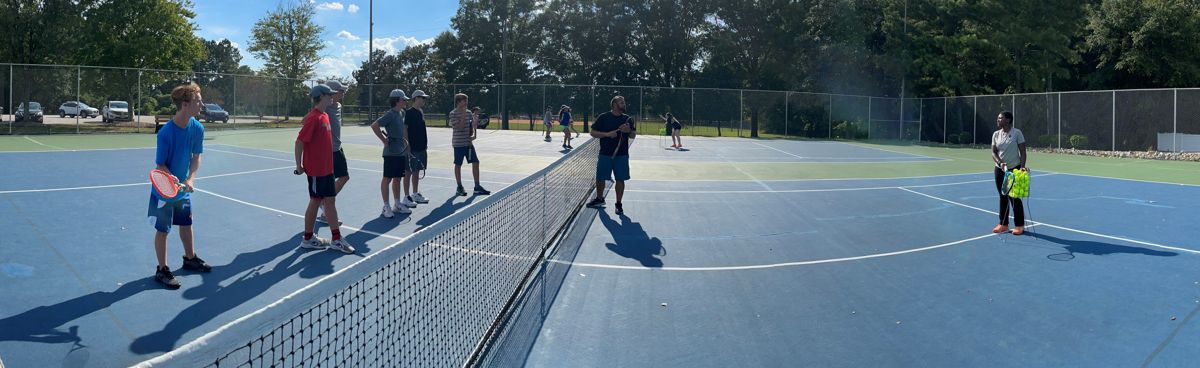 Big NC players on the courts during a clinic