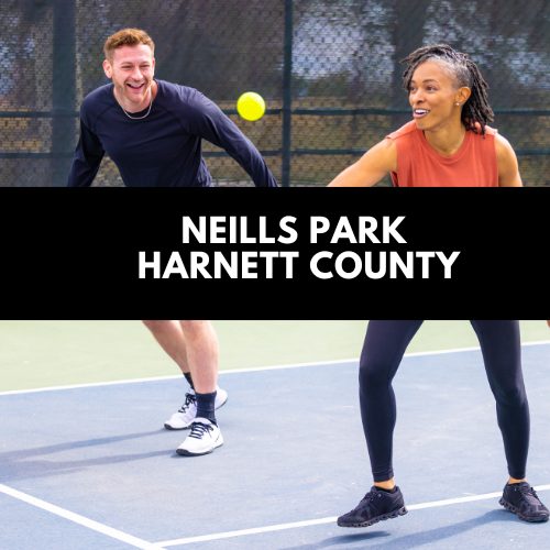 Players on the blue outdoor courts at the Neills Creek courts behind Harnett Central