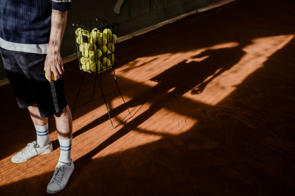 Tennis practice basket on court